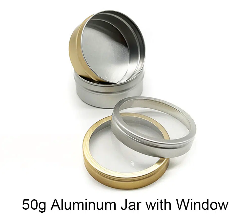 This 50ml glossy gift container with a PVC window is normally made of a 0.3mm-thickness aluminum sheet, with a size of Dia52* H25 mm and a plastic liner, it can be thicker according to the customers' requirements. Its opening is smooth and strong enough. It can be decorated as silk screen printing, offset printing, labeling, lasering, hot stamping, or plated coating. There are 500+ existing metal bottles here, contact us for free samples and more information.